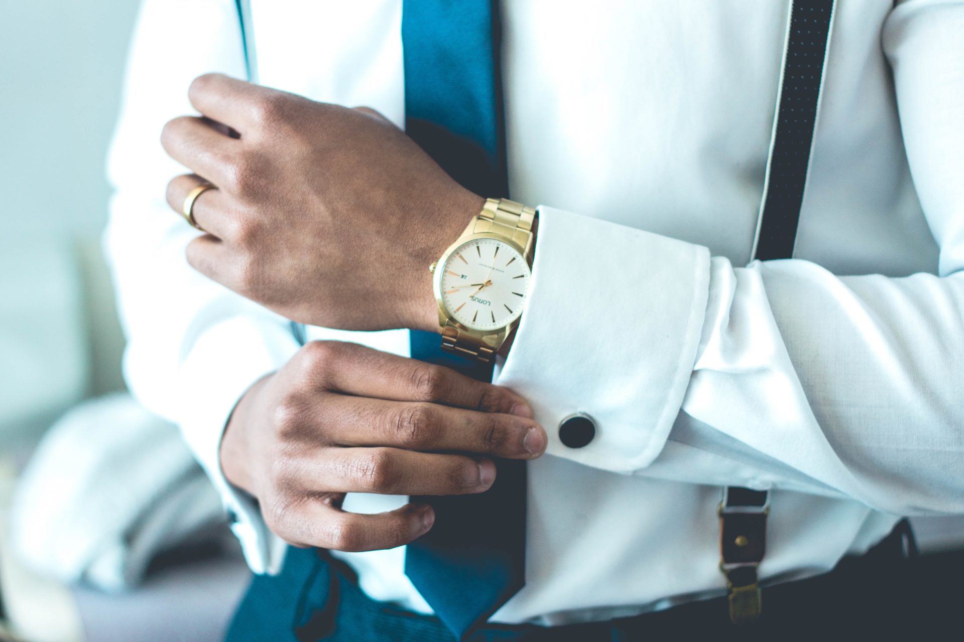 Man in shirt and tie with expensive watch